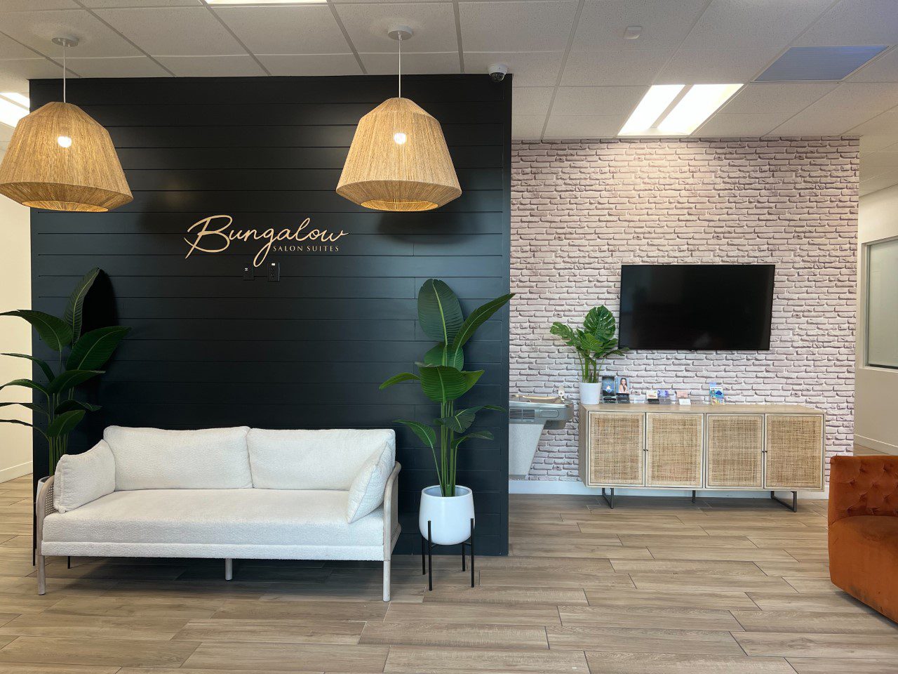 Bungalow Salon Suites With White Sofa And Television